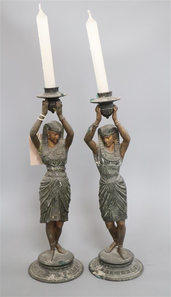 A pair of spelter Egyptian figural candlesticks height 38cm